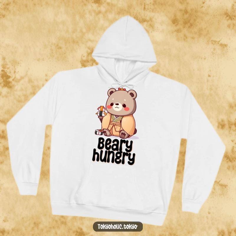 Funny hoodie featuring a chubby bear in a colorful kimono, hilariously balancing a stack of toy sushi, exuding warmth and humor.