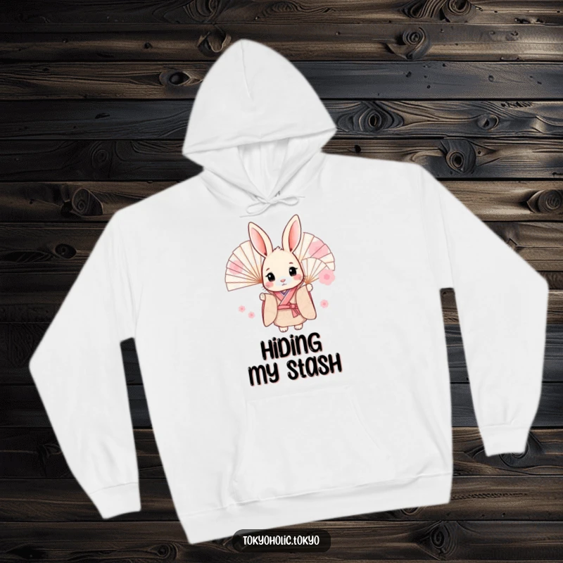 Funny hoodie depicting a sweet bunny wearing a patterned kimono, peeking playfully from behind fans, offering warmth and humorous charm.